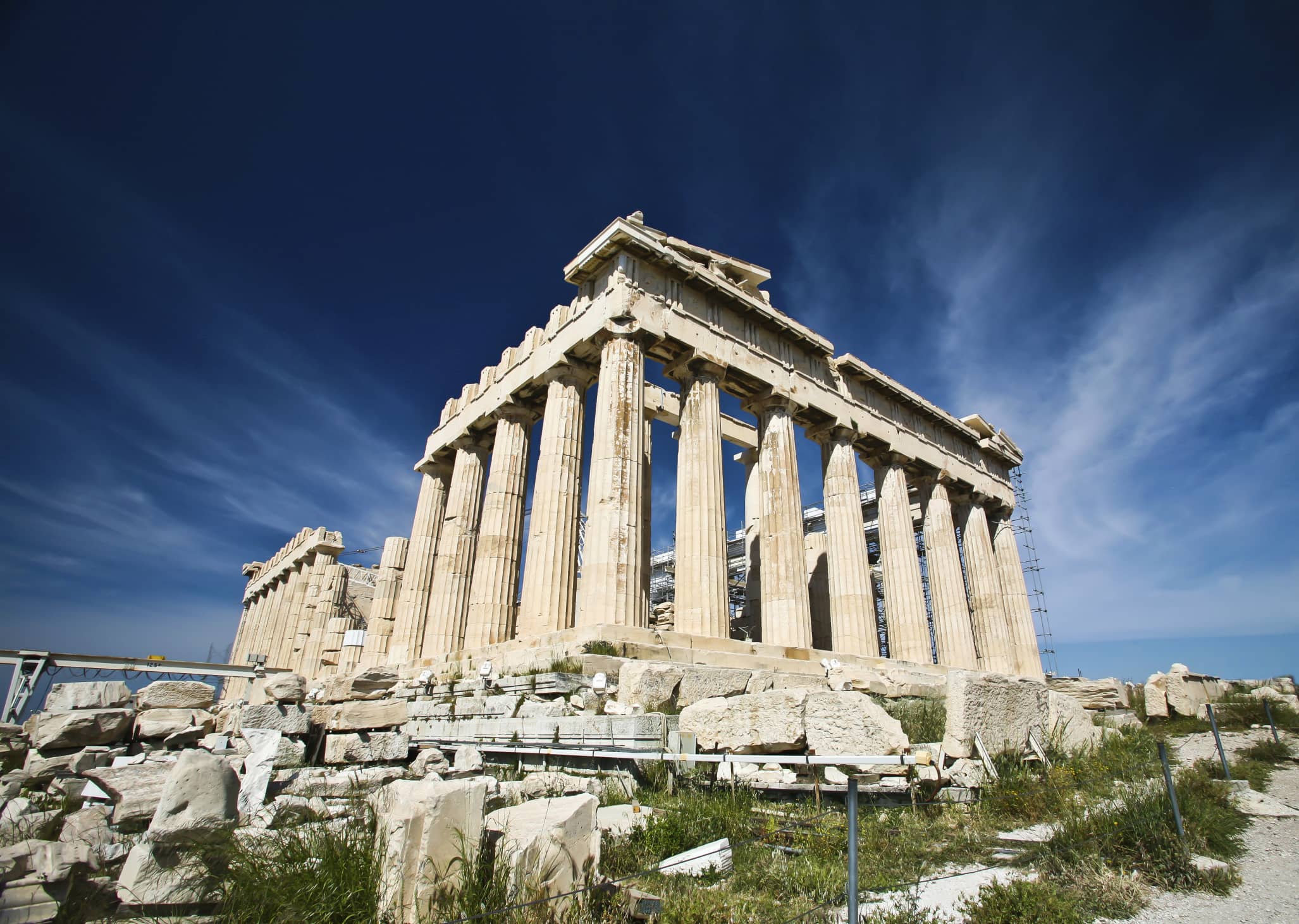 Stunning view of the historic Parthenon temple on the Acropolis in Athens, Greece, under a clear blue sky. Explore ancient wonders with JKV Travel.