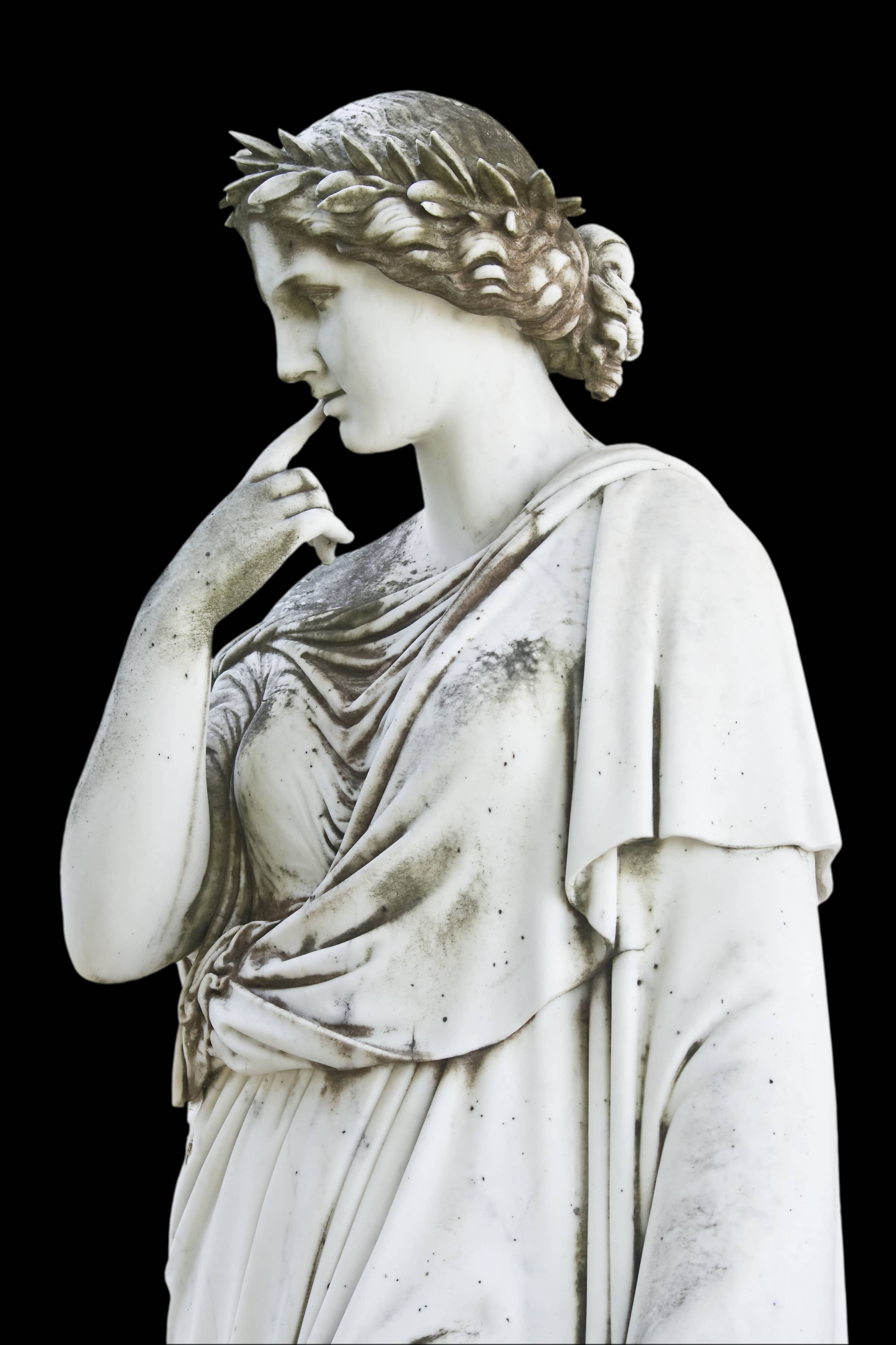 Statue on black background showing a greek mythical muse