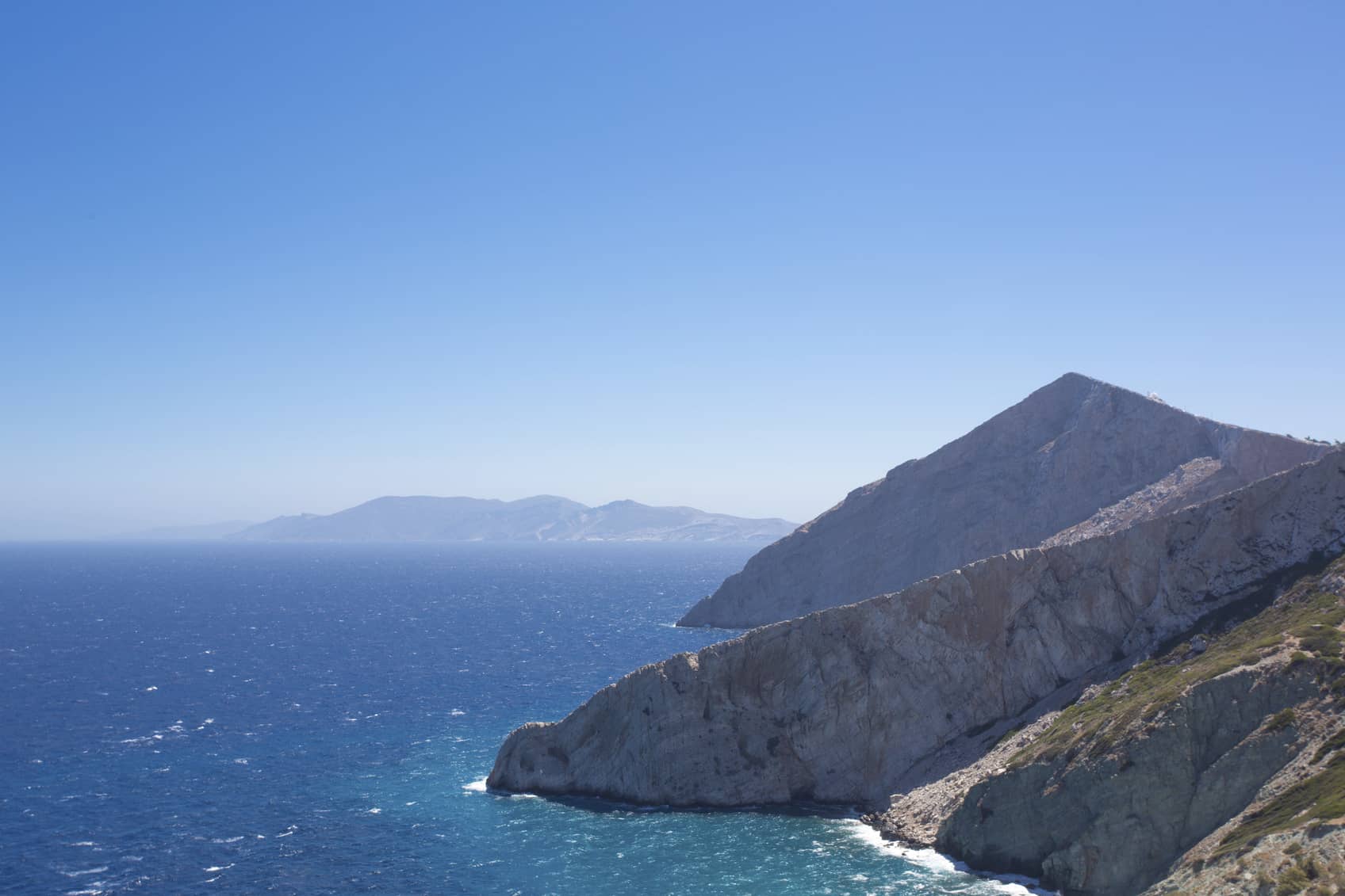 Beautiful view of the shoreline, the Aegean sea and the rocky mountains of Folegandros, an amazing island from Greece 2013.