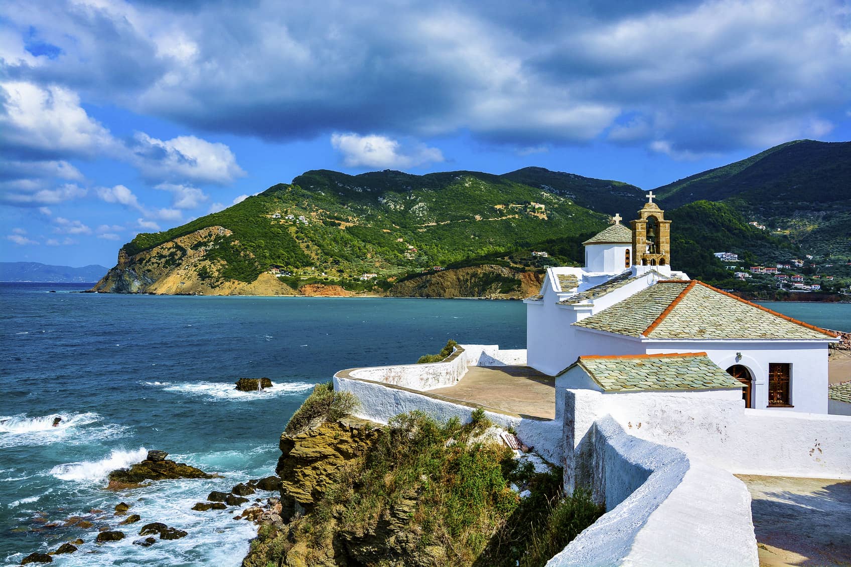 Beautiful view of Panagitsa Tou Pirgou church over the Skopelos bay on a windy summer day, Skopelos, Northern Sporades, Greece