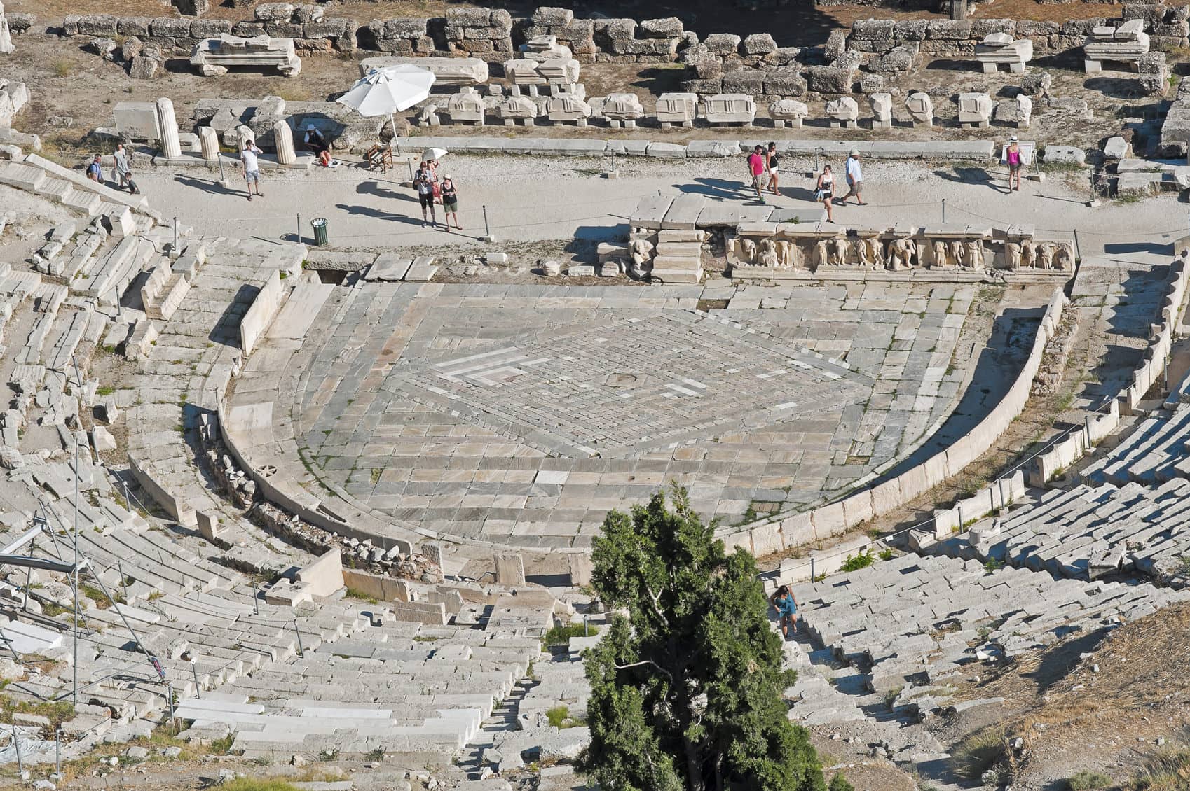 Athens, Greece - July 31, 2014: Remains of the Theater of Dionysus Eleuthereus on July 31, 2014 in Athens, Greece attracts tourists from all over the world.