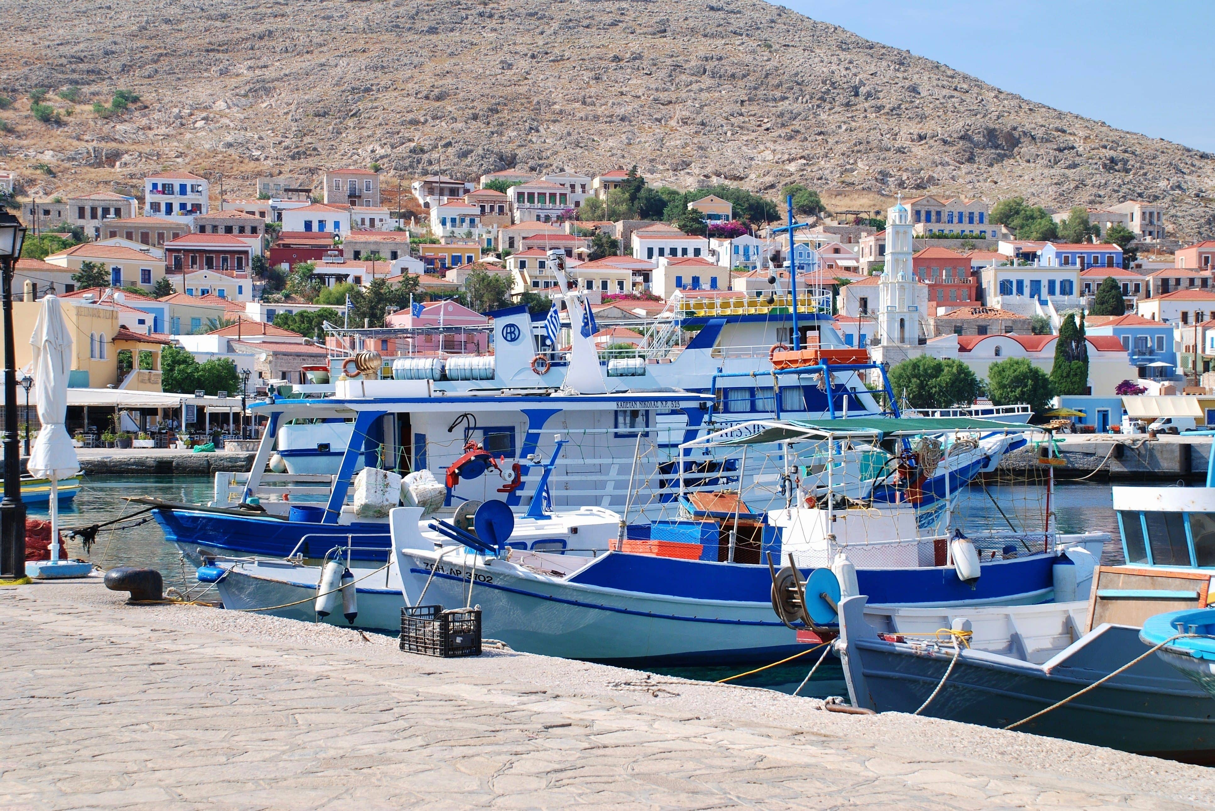 Halki, Greece - June 5, 2015: Small boats moored in the harbour at Emborio on the Greek island of Halki. The Dodecanese island has a population of less than 300 people.